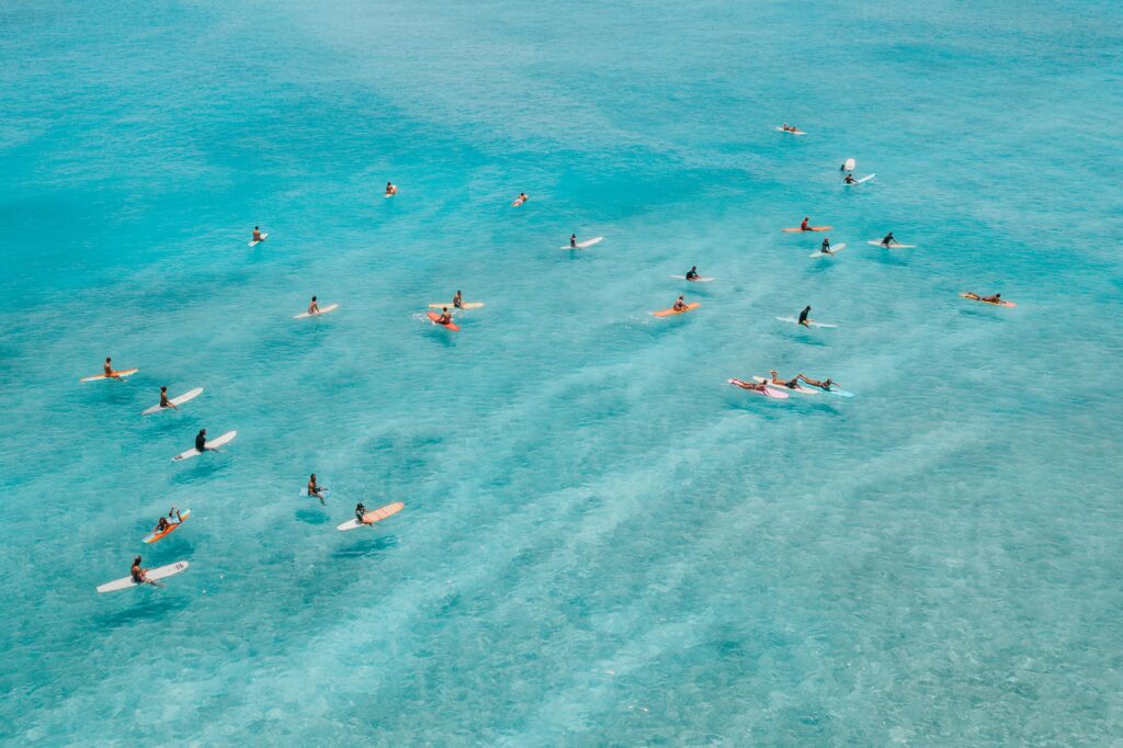 pexels photo 4602222 4602222 Elevated view of surfers paddling on vibrant blue waters in Hawaii, capturing the essence of island lifestyle.
